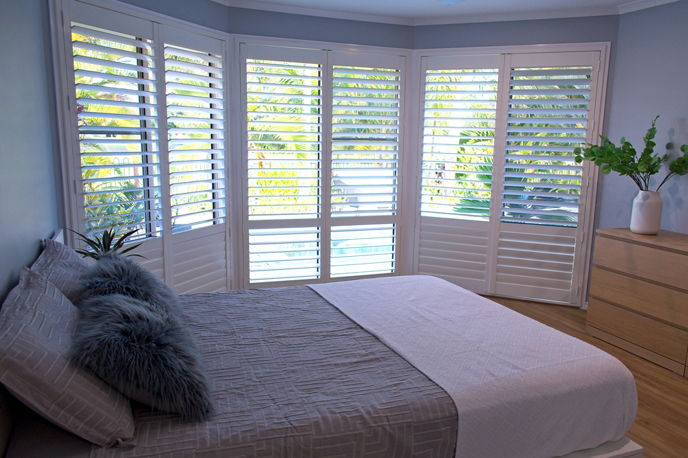 Luxury plantation shutters in bedroom